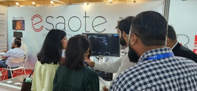 Discussing an Esaote system with visitors