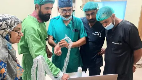 Preparing the probe cover with the OT team